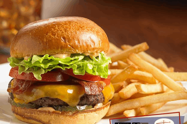 Maurizio's SQ classic cheeseburger with bacon, lettuce, tomato and fries.