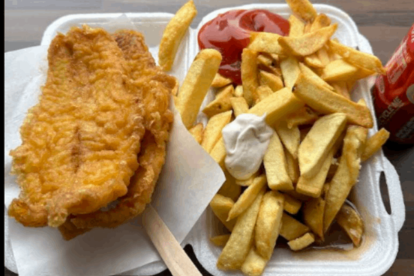 A takeaway container from Maurizio's SQ holds two pieces of fried fish and a large portion of thick-cut chips.